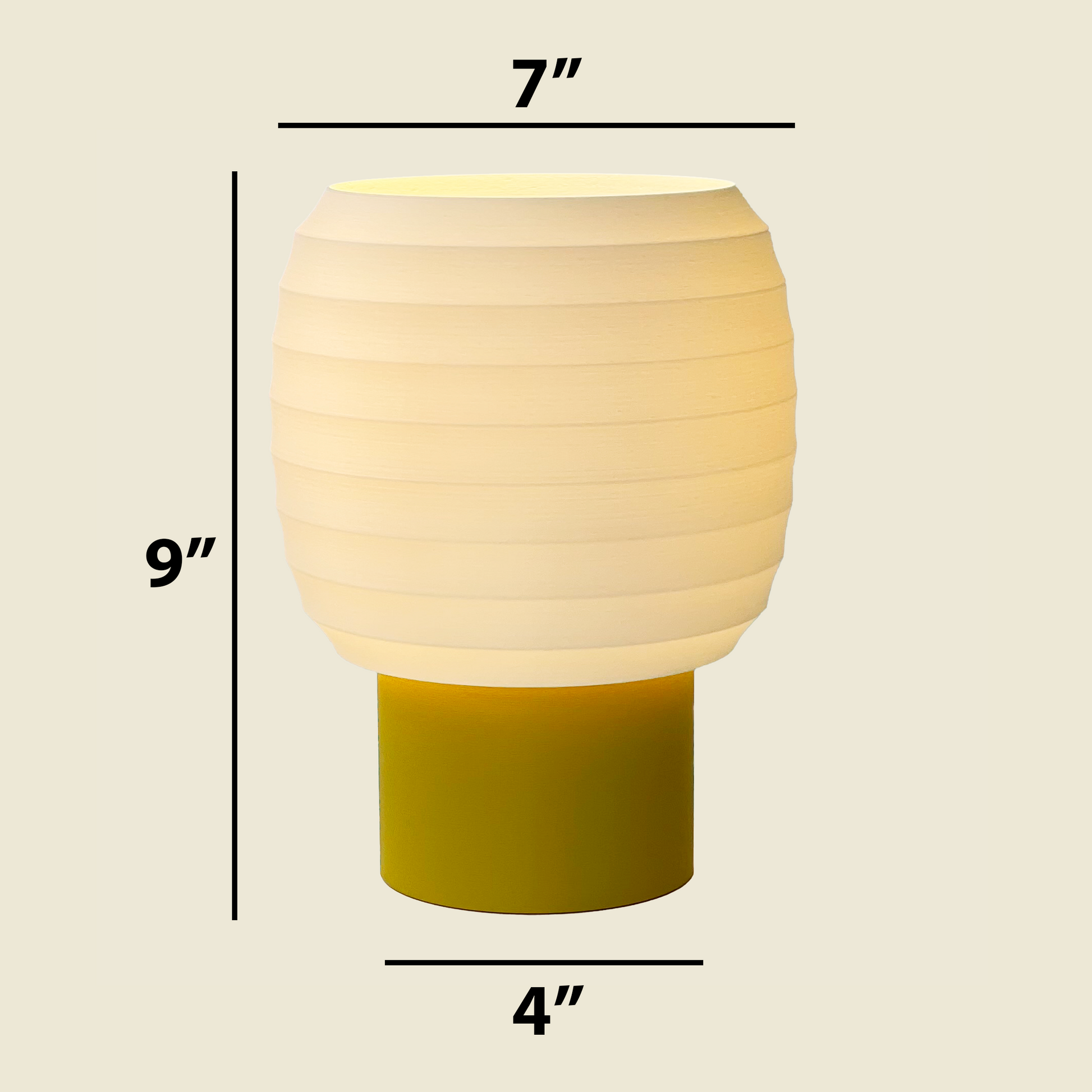 a yellow and green table lamp with measurements