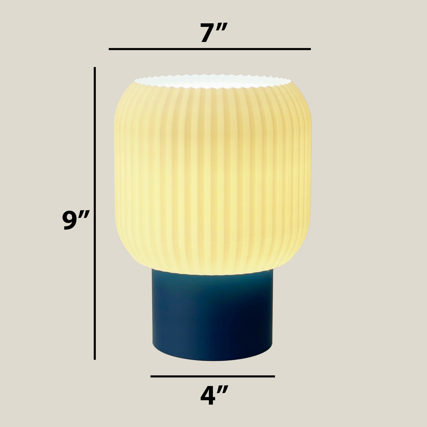 a blue and yellow lamp sitting on top of a table