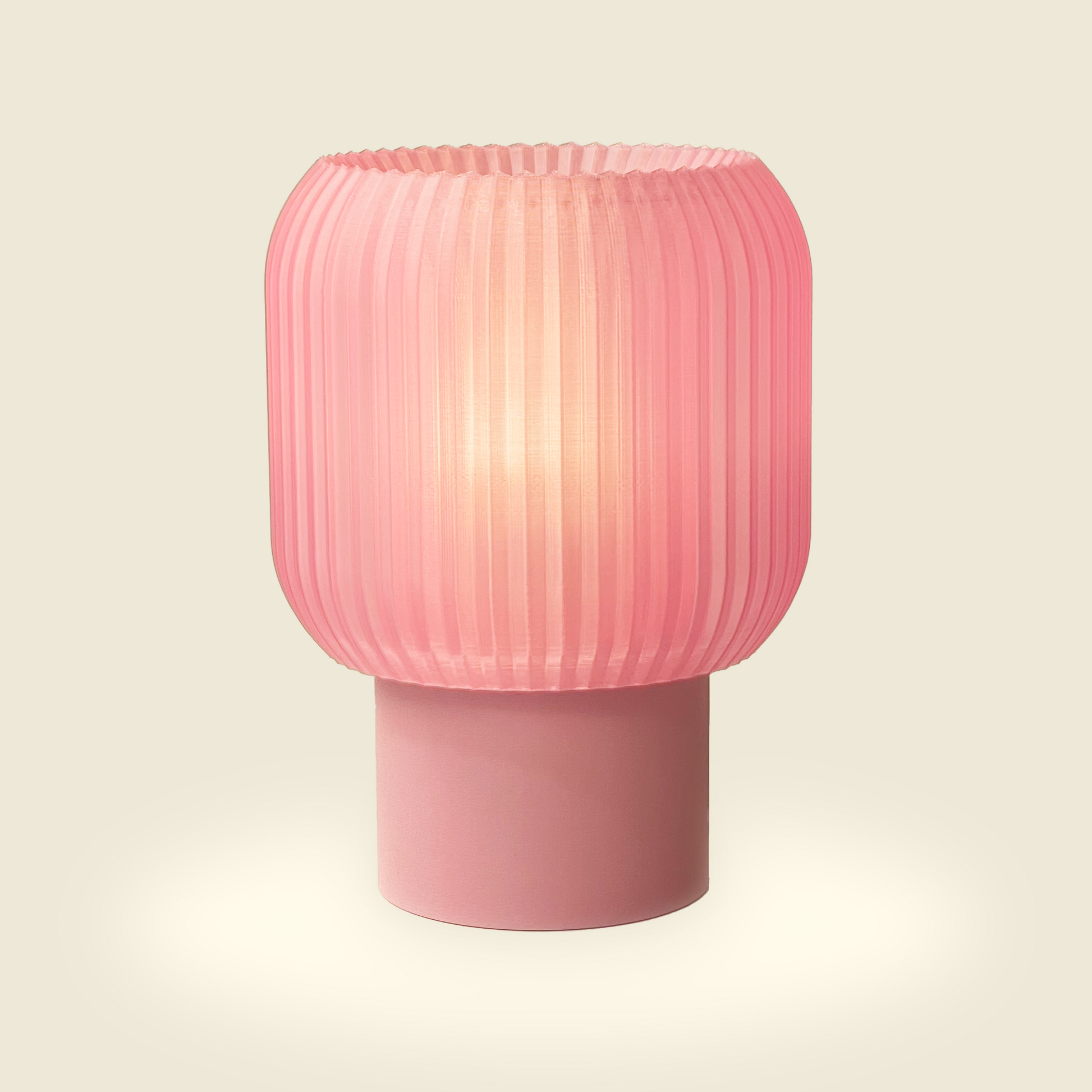 a pink lamp sitting on top of a table