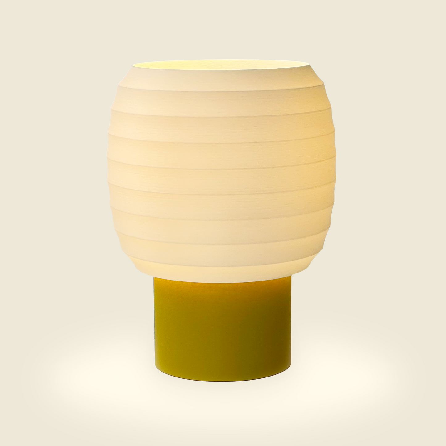a white and yellow lamp sitting on top of a table